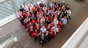 UTSW Cardiovascular team members and leaders pose in a heart shape for a photo in William P. Clements Jr. University Hospital to bring attention to cardiovascular health issues during February’s American Heart Month and, highlighting women in particular, on National Wear Red Day.