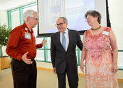 Dr. Daniel K. Podolsky (center) congratulates 40-year employees Steve and Jeanne Seitz.
