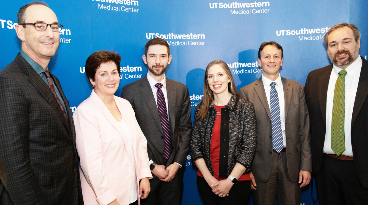 Group of speakers smiling for photo