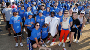 A team of walkers poses near the UT Southwestern tent.