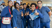 From left: Animal Resource Center employees Shaylyn Dodd, LaBrillia Thomas, Cherquentia Crawford, JaLeasa Bowen, and Carmelo Tobon pose for a group photo.