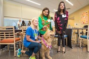 Cindy Bedford poses for the camera with her dog, Callie, Ms. Ali, and Ms. Mehdi.