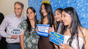 Koshma Eswaramoorthy, center, has fun at the photo booth with her family.