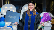 A bouquet of flowers is the perfect complement to a new diploma for Neuroscience graduate Andrea Boitnott, Ph.D.