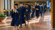 Graduates begin their procession to the auditorium.