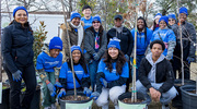 Community members put teamwork into action to beautify the neighborhood by planting trees.
