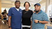 From left: Opie (Robert) Cummings II, a Hyperbaric Oxygen Technician, welcomes his guests Kaye Nichols and Stephen Warren to join the UTSW community for the celebration.