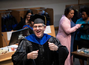 Associate Dean Dr. Stuart Ravnik enjoys a laugh on graduation day.