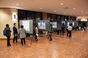 Visitors review the work of medical students at the 57th Annual Medical Student Research Forum.