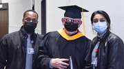 Cameron Ward (left), Tim Williamson (center), and Pooja Venkatesh of Student Life welcome and assist guests in finding their seats prior to the ceremony.