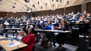 The audience applauds following a closing address by Andrea Askins, Hispanic-Latino BRG Chair.