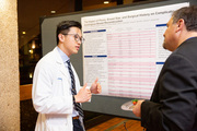 Medical student Jeffrey Li discusses his research project about complications associated with autologous breast reconstruction with Dr. Yasin Dhaher.
