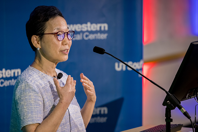 Woman speaks from UTSW podium.