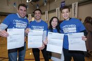 (Left to right) Graham Andre, Angel Andres Valencia, Brenda Zhou, and Joshua Mehr hold up their letters.