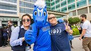 Yoon Jung Kim, Ph.D., (left) and Stanley Lim posing with Champ.