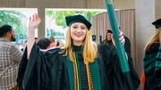 Avery Young, M.D., cheers the achievement of her long-sought medical degree.