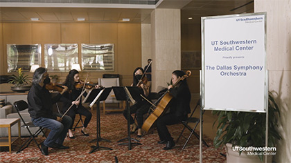 string quartet plays in hospital