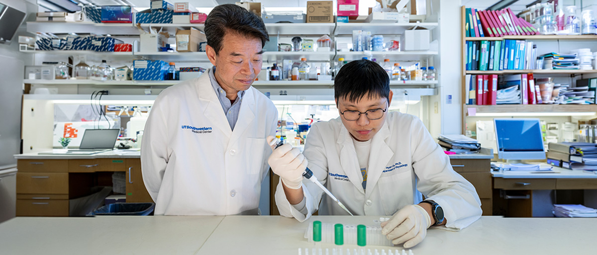 Two scientists working with samples in a lab.