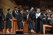 Medical School students shaking hands with educator