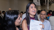 Veena Peraka celebrates her match beside her proud parents.
