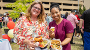 UTSW community members show off their fresh orders with a side of dessert.