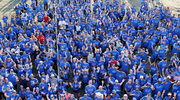 UT Southwestern walkers wave to the camera for a group photo before the start of the 2023 Dallas Heart Walk. Thousands of UTSW employees, friends, and family members turned out for the Sept. 23 event. With help from more than 2,700 registered walkers and 198 teams from UTSW, over $39,000 was raised for American Heart Association efforts, which include assisting heart disease and stroke patients, funding research at UTSW and other research centers, and promoting wellness initiatives.