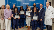 Health System leadership pictured with Platinum pin recipients.