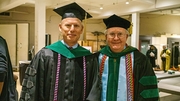 Philip Greilich, M.D., Professor of Anesthesiology and Pain Management (left) and William Turner, M.D., Professor of Surgery and Master of Sprague College, get ready for the ceremony.