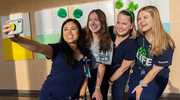 Four Nursing team members at Clements University Hospital pose for a festive group selfie on National Donate Life Blue and Green Day in April, an event to bring awareness to organ donation.