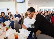 45-year service honoree Bernadine “Bernie” Wafford gets a hug from her supervisor, NICU Nurse Manager Aziza Young.
