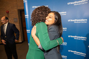 Dawn Cureton embraces MLK Scholarship recipient Priya Mathew.