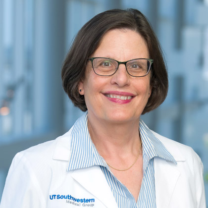 Woman with glasses and a lab coat