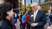 Dr. Brown speaks to a well-wisher outside Gooch Auditorium during the celebration of his 50-year research partnership with Dr. Goldstein.