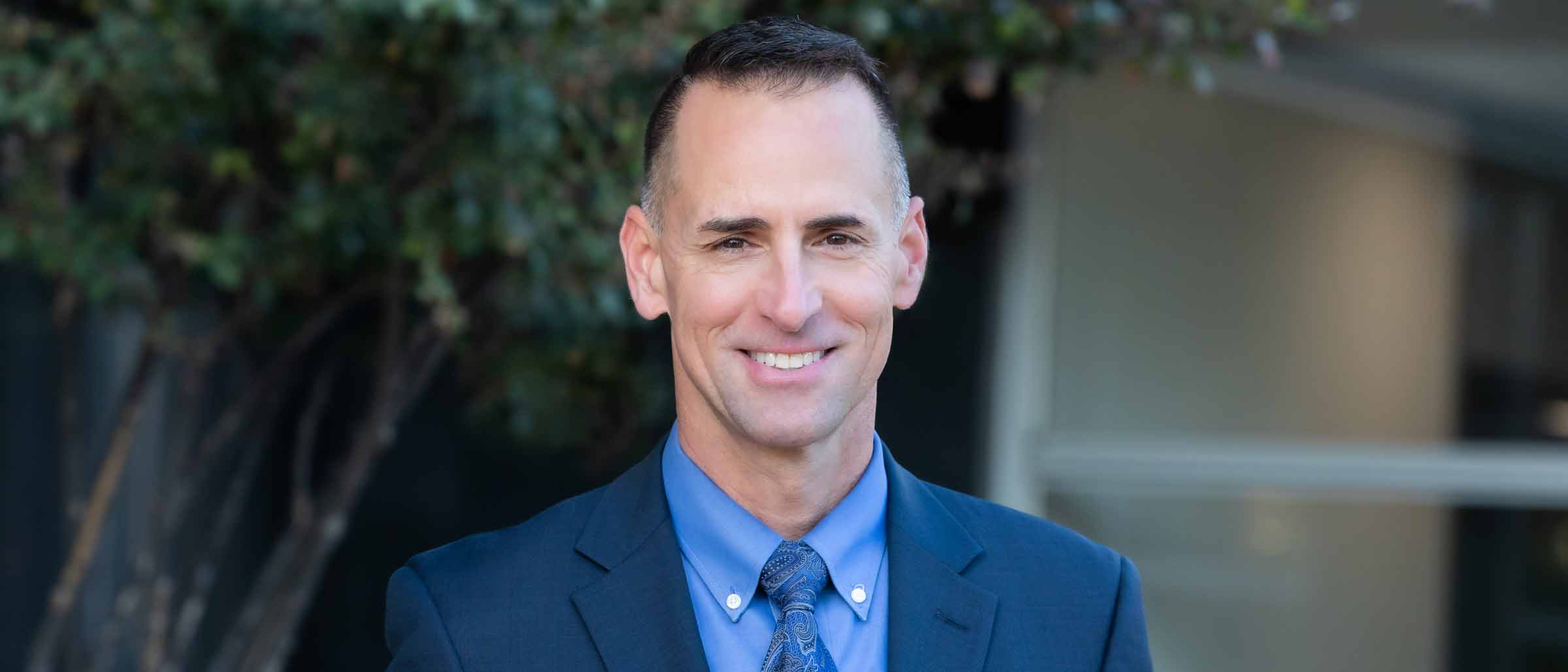 Man in suit with yellow tie