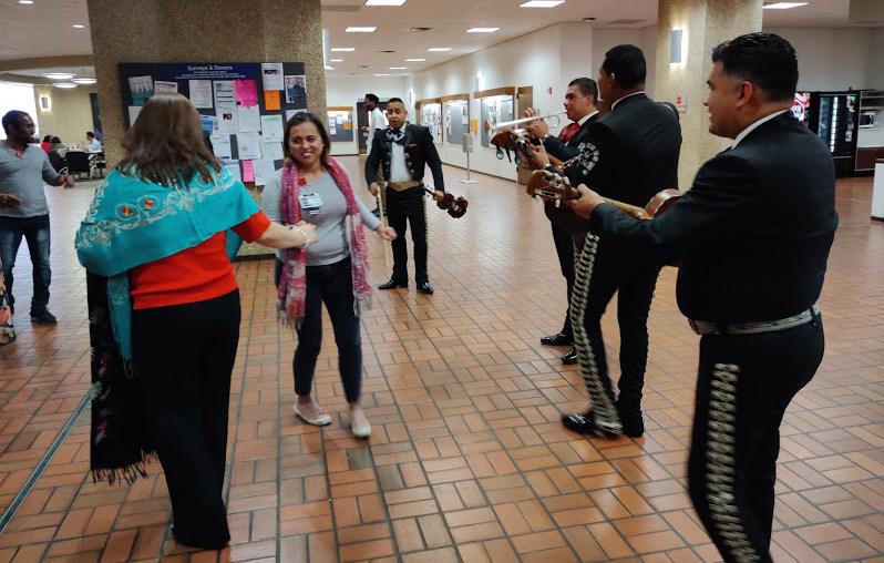 A UTSW staff member joined a performer for a dance.