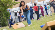 Fatima Roque enjoys a fun outdoor game of cornhole.