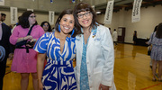 Vanessa Ramirez-Allen (left) gets a congratulatory hug from Angela Mihalic, M.D., Dean of Medical Students and Associate Dean for Student Affairs.