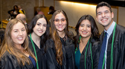 Master of Physician Assistant Studies program graduates posing for a group photo include, from left, Megan Bauer, Yadaris Bonilla, Lianne Bencomo Tejeiro, Estela Cias, and Anthony Solhjoo.