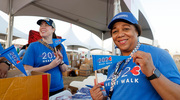 A walker shows off her new UTSW Heart Walk flag.