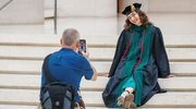 Audrey Watts, M.D., poses for a portrait in full commencement regalia.