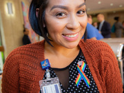 Nicole Arredondo sports a rainbow Pride ribbon, which were offered for program attendees.