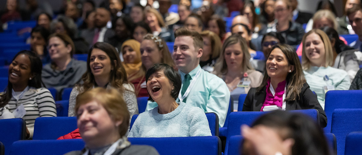 Audience of people laughing