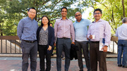 Five members of the UTSW community enjoy the October weather at the outdoor celebration honoring Drs. Brown and Goldstein.