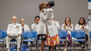 Master of Physician Assistant Studies student Ashley Louis-Jeune (right) receives a warm embrace from Carolyn Bradley-Guidry, Dr.PH., M.P.A.S., PA-C, Associate Dean for Student Affairs and Engagement – School of Health Professions, at the program’s White Coat Ceremony in July. In 2023, the program celebrated 50 years since its initial accreditation. Ms. Louis-Jeune is set to graduate in 2024.