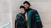 Afza Mohammed, M.D., and Shoaib Syed, M.D., share a moment together before crossing the stage.