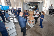 Hospital staff workers load meal donations given by the Dallas Mavericks. Businesses, organizations, and individuals are able to send donation requests to feed health care workers while campus food courts are closed amid the pandemic.
