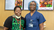Cequinta Robinson (left), an Education Assistant in the Department of Nursing, and Kimberly Robinson, Manager of Undergraduate Medical Education and an RN, pose for a photo.