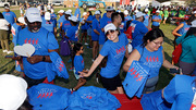 UTSW supporters pick up their Heart Walk T-shirts.