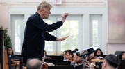 A conductor’s perfect guidance makes harmonious music.