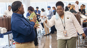 Kenson Johnson of Surgical Services enjoys an impromptu dance with Annie Davidson, Nutrition Services Coordinator, as music plays during the event.